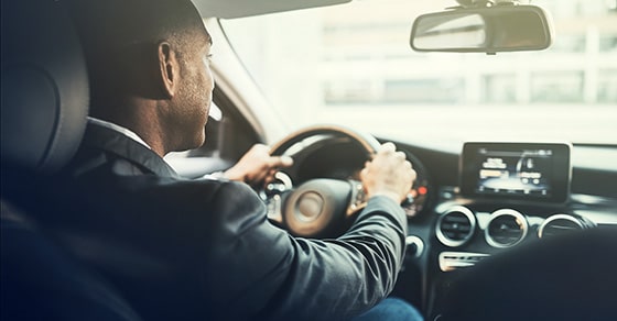 guy driving a car