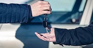 two hands exchanging keys
