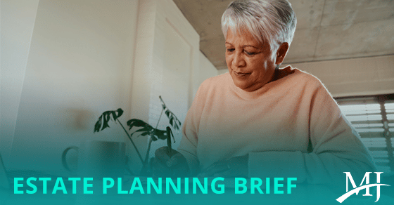 "Estate Planning Brief" Photo of woman writing in notebook