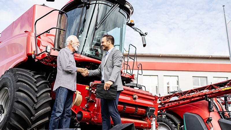 Farmer,And,Dealer,Shaking,Hands,After,Successful,Tractor,Purchase.,Investing Farmer,And,Dealer,Shaking,Hands,After,Successful,Tractor,Purchase.,Investing