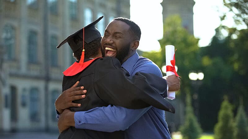 Cheerful,Father,And,Graduating,Son,Hugging,Outdoor,,Study,Achievement,,Education Cheerful,Father,And,Graduating,Son,Hugging,Outdoor,,Study,Achievement,,Education