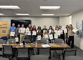 Mauldin & Jenkins  Professionals Assemble Snack Bags for Local Children in Need