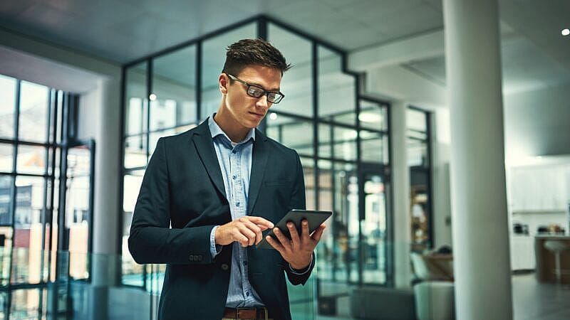 Tablet,,Serious,And,Business,Man,Research,For,Information,,Update,Or