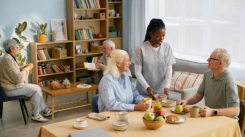 Group,Of,Seniors,Enjoying,Social,Time,With,Caregivers,In,A